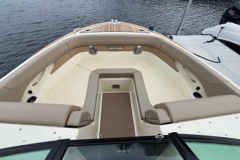 Slide: The Image of Luxurious 2026 Chris-Craft Calypso 28 boat interior with elegant seating and teak accents. - 43