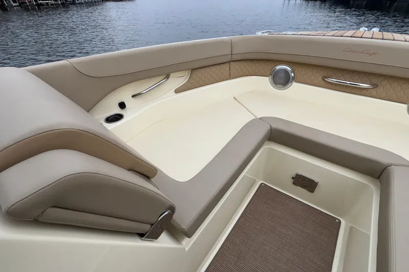 Slide: The Image of 2026 Chris-Craft Calypso 28 boat interior with beige seating and elegant design. - 44