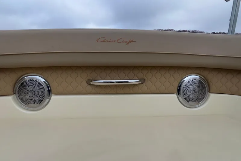 Slide: The Image of 2026 Chris-Craft Calypso 28 boat interior with speakers and elegant beige upholstery. - 49