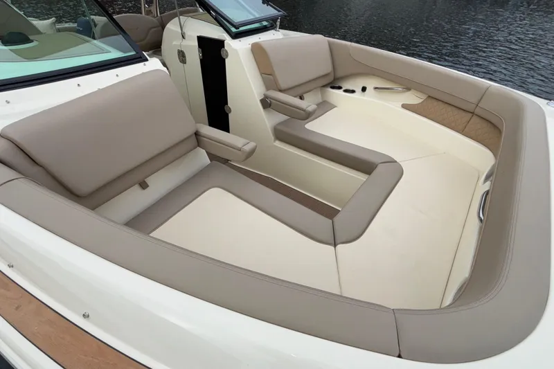 Slide: The Image of Luxurious seating area on 2026 Chris-Craft Calypso 28 boat, featuring elegant beige upholstery. - 51
