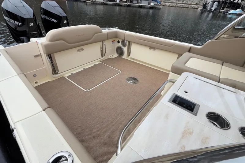 Slide: The Image of 2026 Chris-Craft Calypso 28 boat interior with seating and Mercury engines. - 8