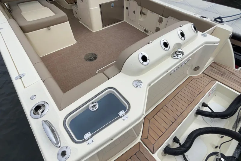Slide: The Image of 2026 Chris-Craft Calypso 28 boat interior with seating and fishing rod holders. - 9