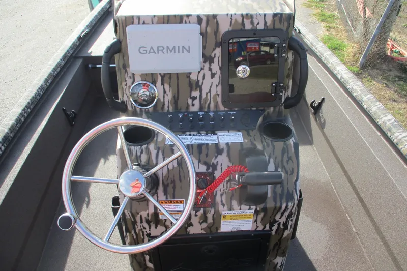 Slide: The Image of Steering console of 2026 Avid 18 Rogue CC boat with Garmin navigation system. - 15