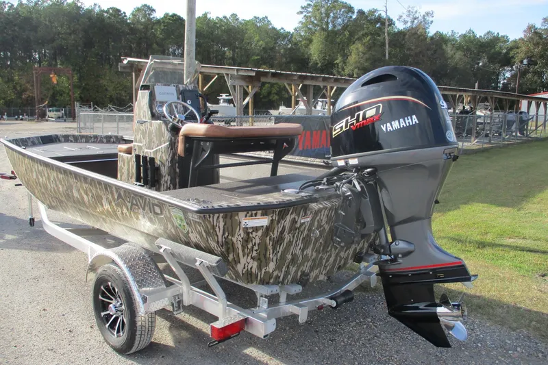 Slide: The Image of Avid 18 Rogue CC 2026 boat with Yamaha engine on trailer, camo design. - 2