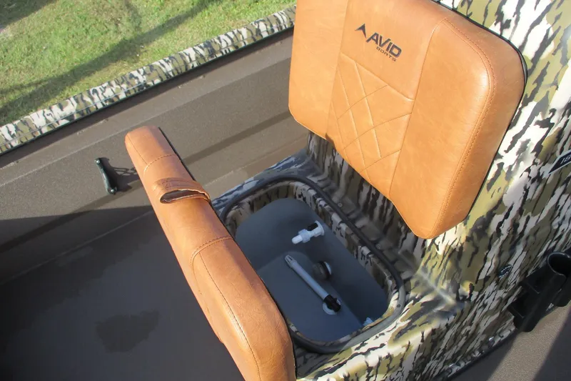 Slide: The Image of Avid 18 Rogue CC 2026 boat seat with storage compartment, camo design. - 8