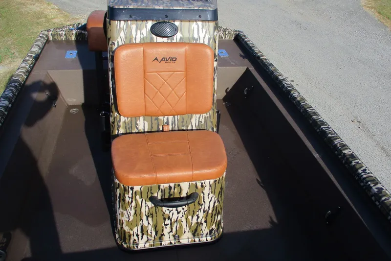 Slide: The Image of 2026 Avid 18 Rogue CC boat with camo design and brown leather seating. - 9