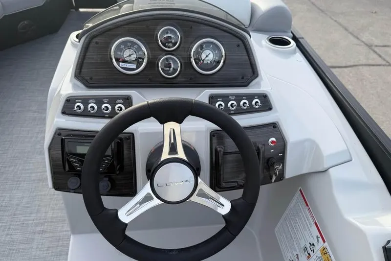 Slide: The Image of Steering console of 2026 Lowe SS 230 WV boat with gauges and controls. - 12
