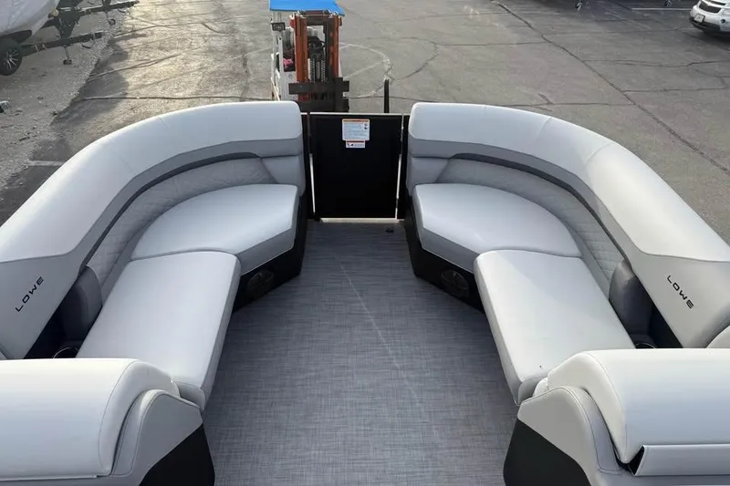 Slide: The Image of 2026 Lowe SS 230 WV pontoon boat with spacious seating and modern design. - 14