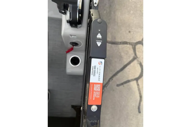 Slide: The Image of Control panel of 2026 Lowe SS 230 WV boat with SureShade system. - 16