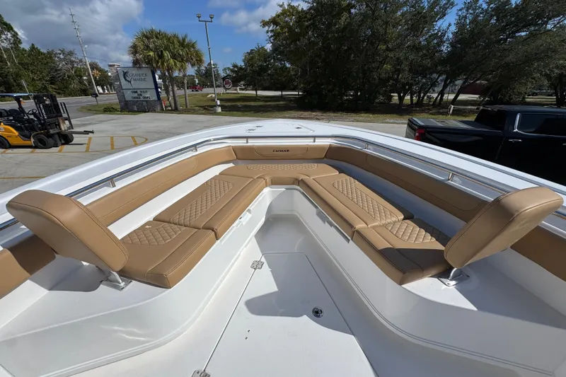 Slide: The Image of 2026 Caymas 291 boat with tan seating and spacious deck area. - 20