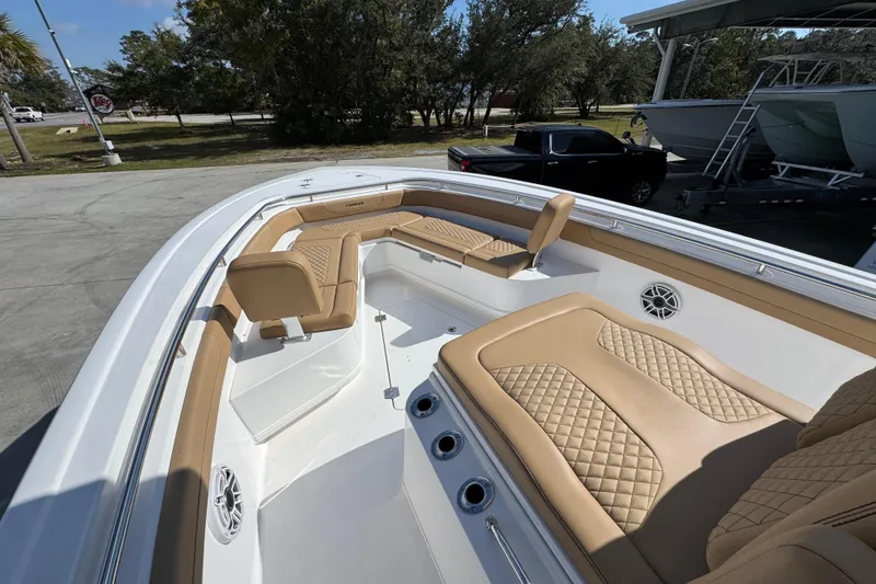 Slide: The Image of 2026 Caymas 291 boat interior with tan seating and modern design. - 21