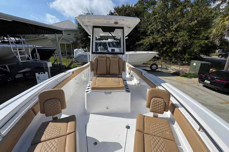 Slide: The Image of 2026 Caymas 291 boat interior with tan seating and modern design. - 24