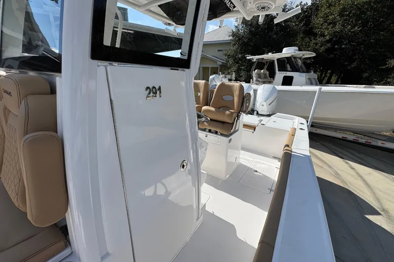 Slide: The Image of 2026 Caymas 291 boat interior with tan seating and modern design. - 25
