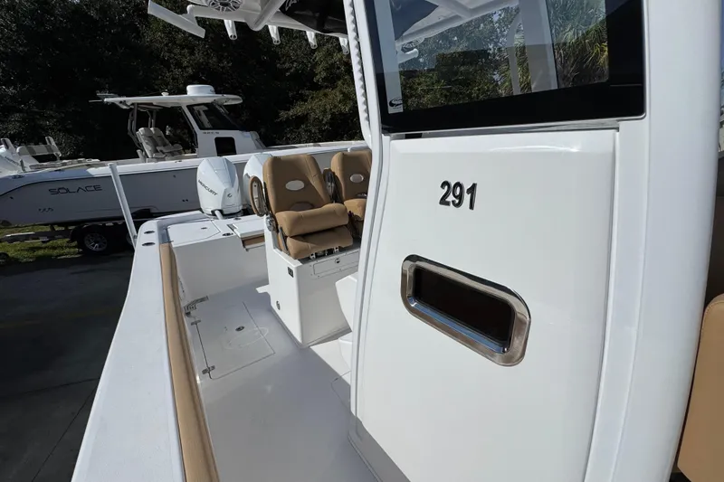 Slide: The Image of 2026 Caymas 291 boat interior with seating and console details. - 26