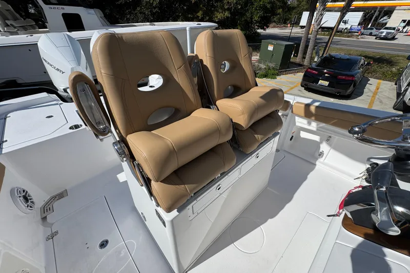 Slide: The Image of 2026 Caymas 291 boat with tan leather seats and modern design. - 35