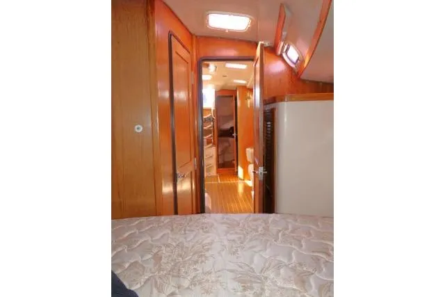 Slide: The Image of Interior view of 2008 Catalina 400 MK II sailboat cabin with wood finish. - 24