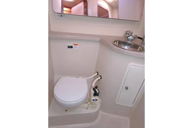 Slide: The Image of 2008 Catalina 400 MK II yacht bathroom with toilet, sink, and mirror. - 29