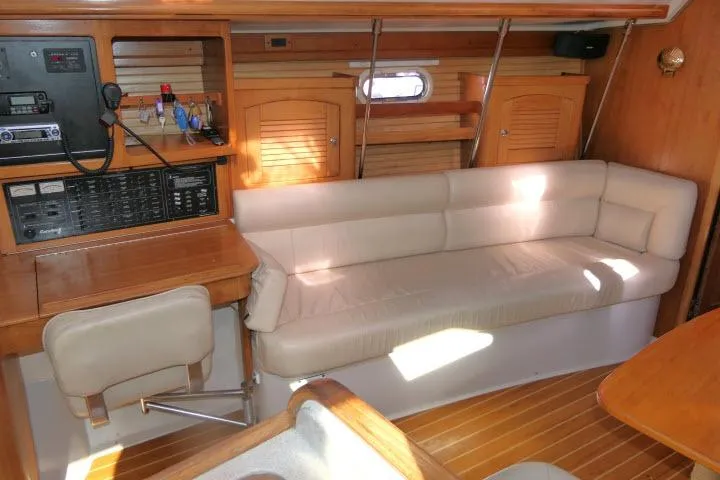 Slide: The Image of Interior of 2008 Catalina 400 MK II sailboat with beige seating and wooden accents. - 3