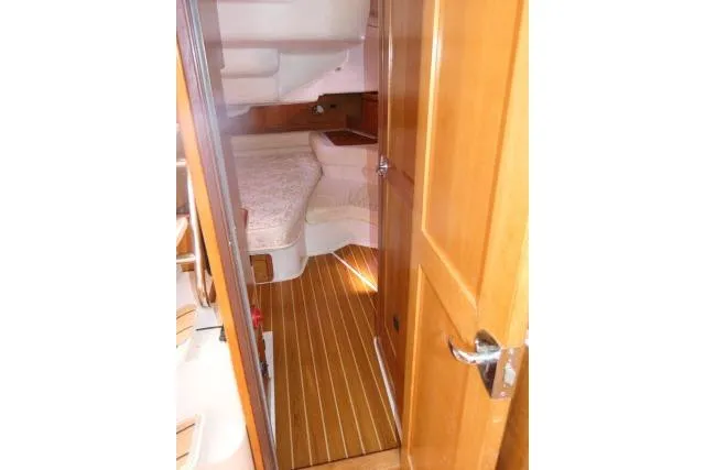Slide: The Image of Interior view of 2008 Catalina 400 MK II sailboat cabin with wooden flooring. - 30