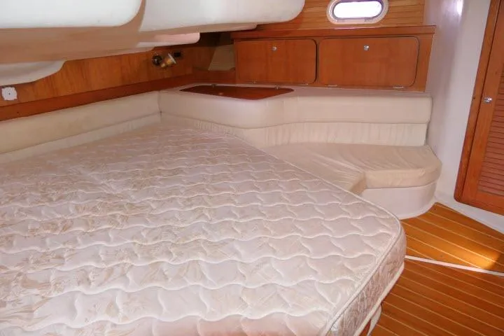 Slide: The Image of Interior cabin of 2008 Catalina 400 MK II sailboat with bed and wooden cabinetry. - 33