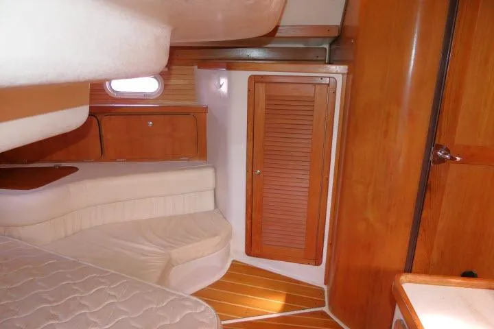 Slide: The Image of Interior of 2008 Catalina 400 MK II sailboat with wooden cabinetry and cozy seating area. - 34