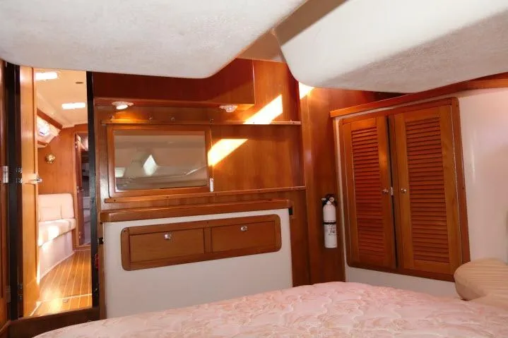 Slide: The Image of Interior of 2008 Catalina 400 MK II yacht with wooden cabinetry and cozy furnishings. - 36