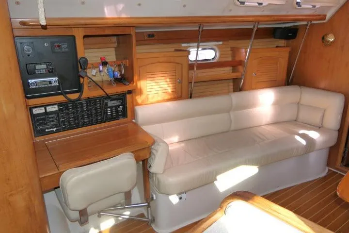 Slide: The Image of Interior of 2008 Catalina 400 MK II sailboat with beige seating and wooden cabinetry. - 4