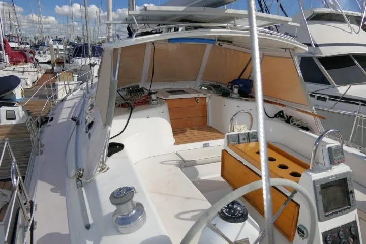 Slide: The Image of 2008 Catalina 400 MK II sailboat cockpit with navigation equipment, docked at marina. - 42