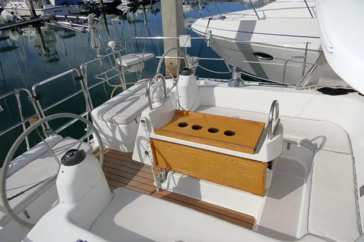 Slide: The Image of Cockpit of 2008 Catalina 400 MK II sailboat with wooden seating and steering wheel. - 46