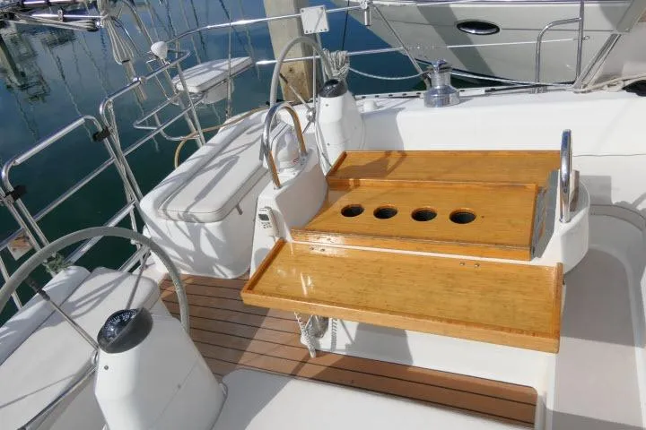 Slide: The Image of Cockpit of 2008 Catalina 400 MK II sailboat with wooden table and seating. - 47