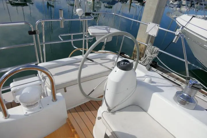 Slide: The Image of Cockpit of 2008 Catalina 400 MK II sailboat with steering wheel and seating. - 49