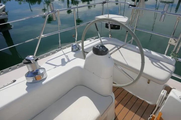 Slide: The Image of 2008 Catalina 400 MK II sailboat cockpit with steering wheel and seating. - 50