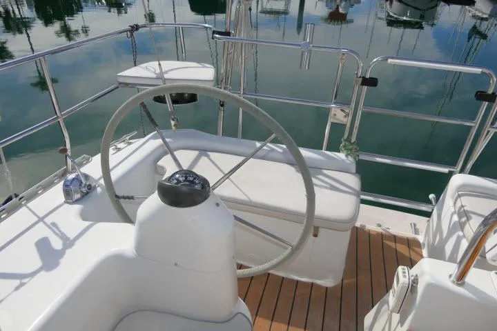 Slide: The Image of Steering wheel of 2008 Catalina 400 MK II sailboat, docked with polished deck. - 51