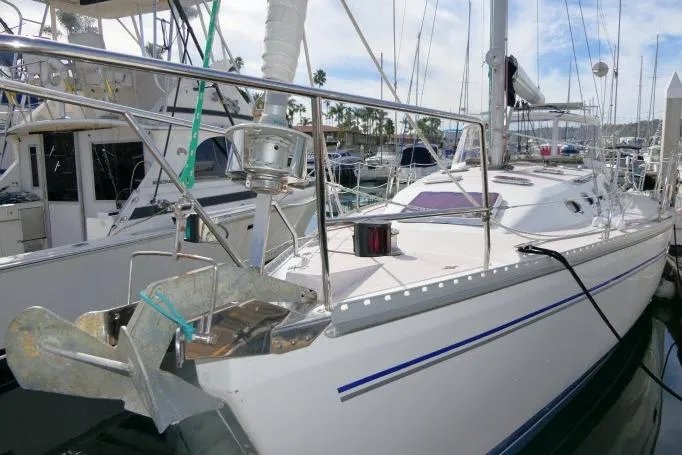 Slide: The Image of 2008 Catalina 400 MK II sailboat docked in marina, featuring sleek design and modern rigging. - 66
