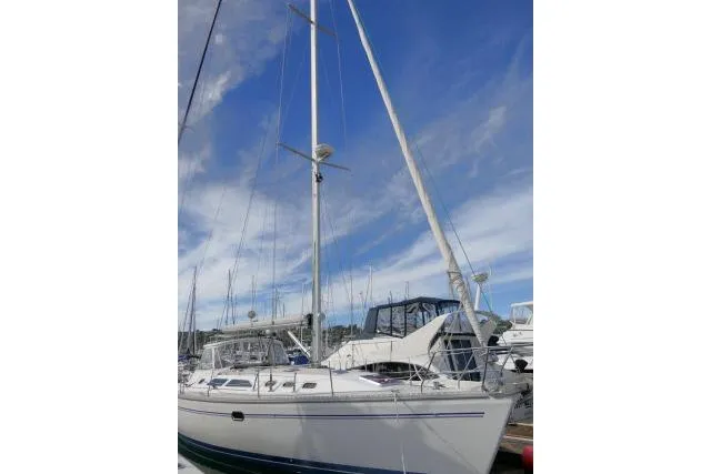 Slide: The Image of 2008 Catalina 400 MK II sailboat docked under a clear blue sky. - 68
