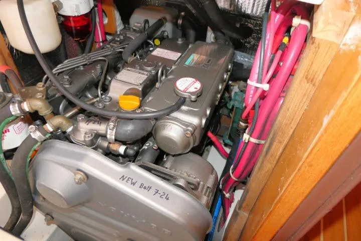 Slide: The Image of Engine compartment of a 2008 Catalina 400 MK II sailboat, showing detailed mechanical components. - 73