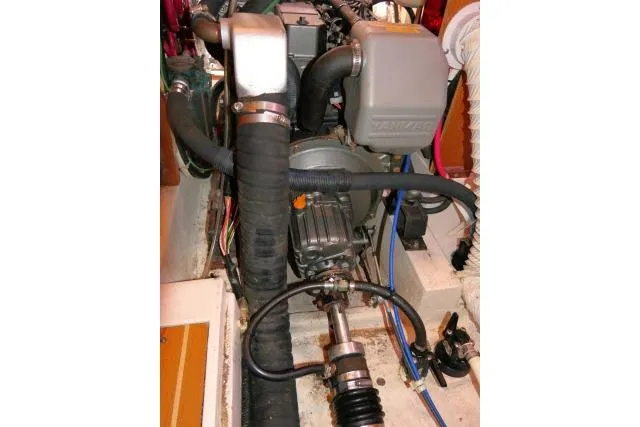 Slide: The Image of Engine compartment of a 2008 Catalina 400 MK II sailboat, showcasing mechanical components. - 74