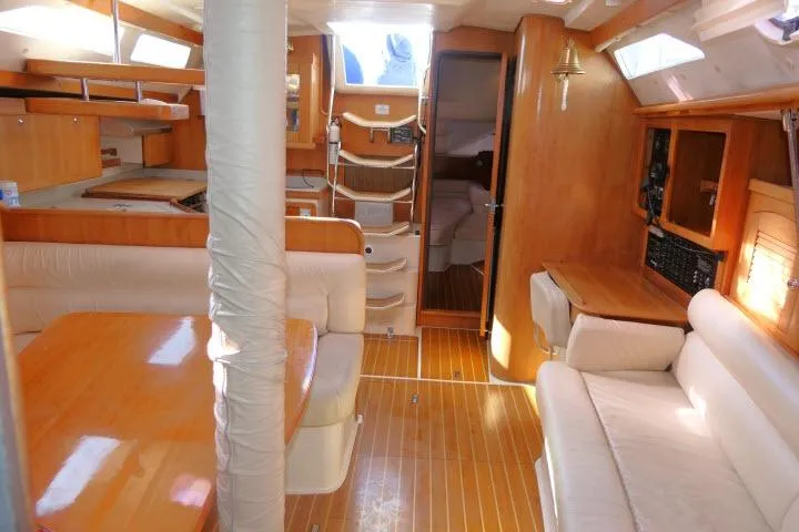 Slide: The Image of Interior of 2008 Catalina 400 MK II sailboat with wood finish and comfortable seating. - 8