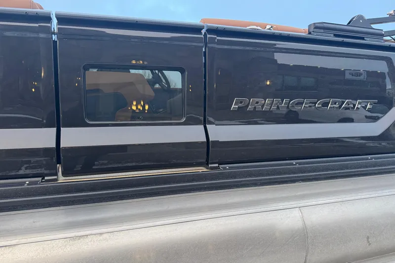 Slide: The Image of 2026 Princecraft Vogue 25 boat exterior with sleek design and window view. - 10