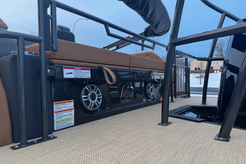 Slide: The Image of 2026 Princecraft Vogue 25 boat interior with speakers and seating, showcasing modern design. - 3