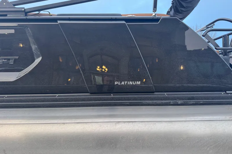 Slide: The Image of 2026 Princecraft Vogue 25 Platinum boat side view with sleek black finish. - 6