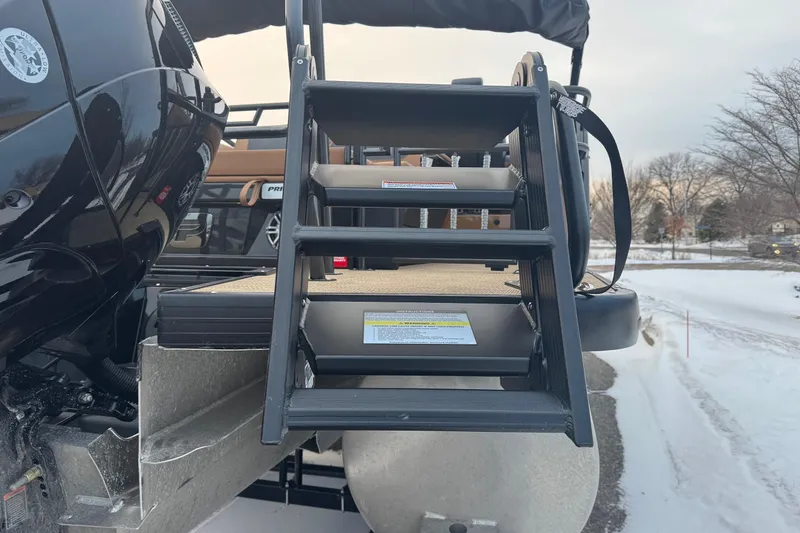 Slide: The Image of Staircase on 2026 Princecraft Vogue 25 boat, snowy background. - 9