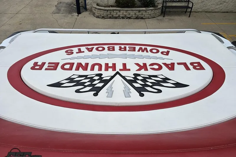 Slide: The Image of 2004 Black Thunder 460 boat logo with racing flags and bold lettering. - 109