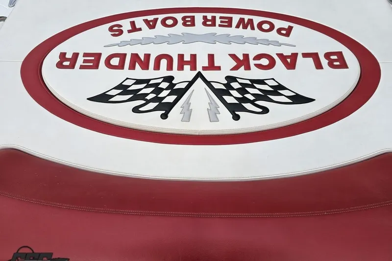Slide: The Image of Black Thunder Power Boats logo on red and white upholstery, 2004 model 460. - 110