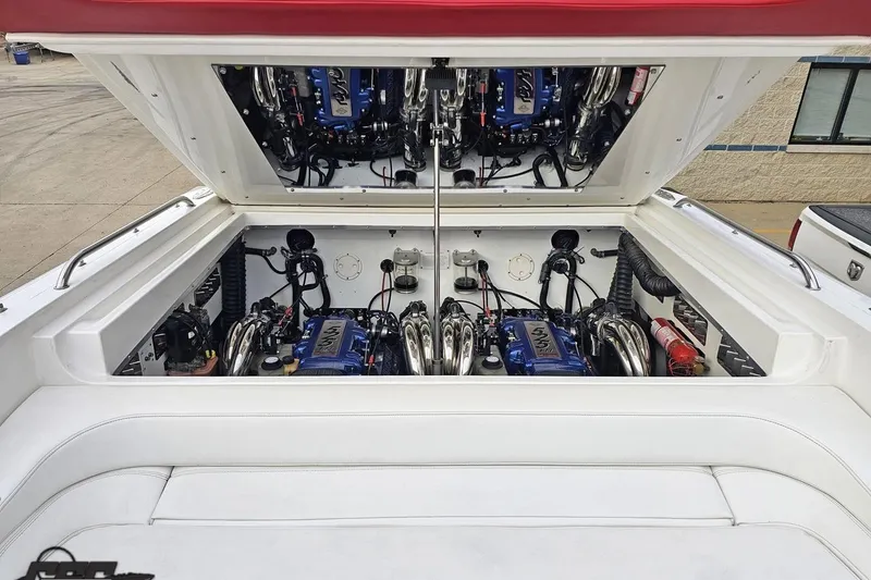 Slide: The Image of Engine compartment of a 2004 Black Thunder 460 boat, showcasing dual engines. - 112
