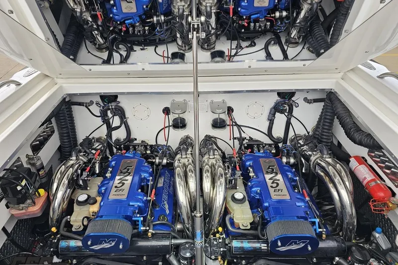 Slide: The Image of Twin Mercury 525 EFI engines in a 2004 Black Thunder 460 boat. - 114