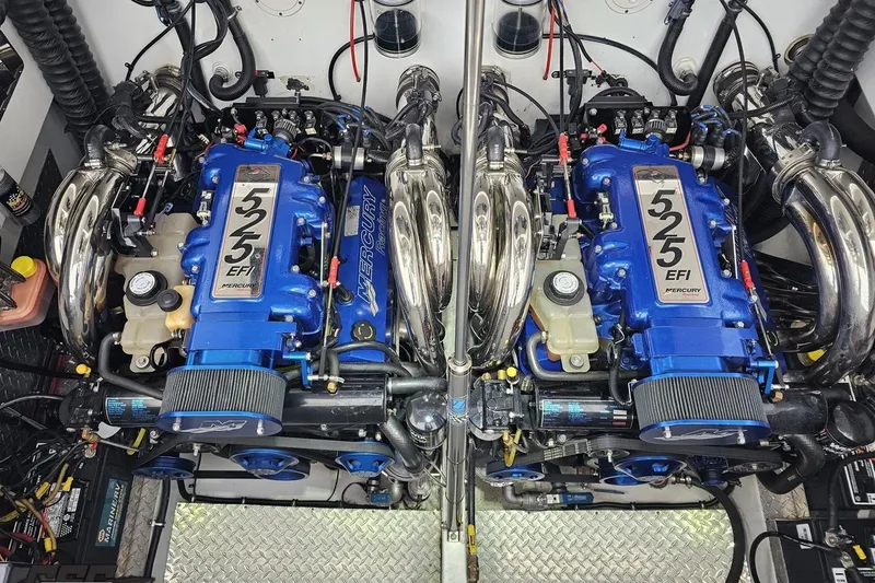 Slide: The Image of Twin Mercury 525 EFI engines in a 2004 Black Thunder 460 boat. - 115