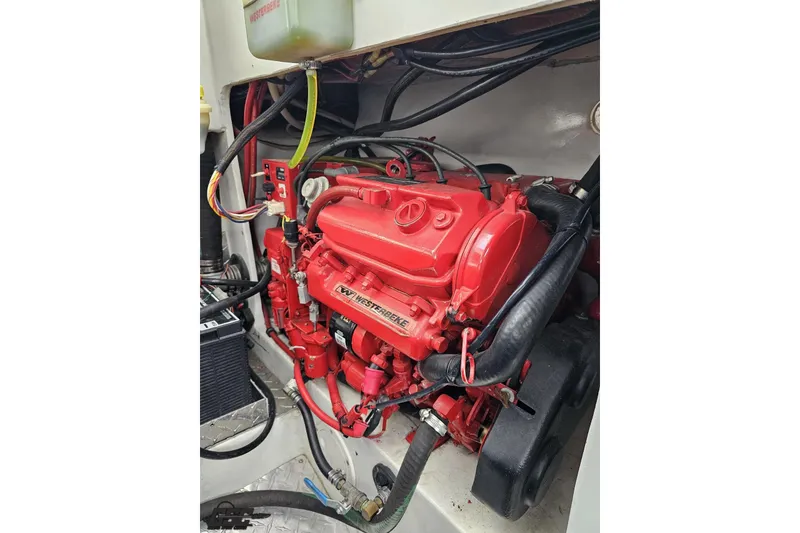 Slide: The Image of Red Westerbeke engine in a 2004 Black Thunder 460 boat, detailed view. - 119