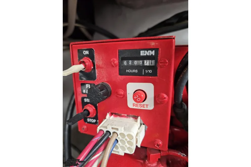 Slide: The Image of Red control panel with hour meter and reset button on a 2004 Black Thunder 460. - 120