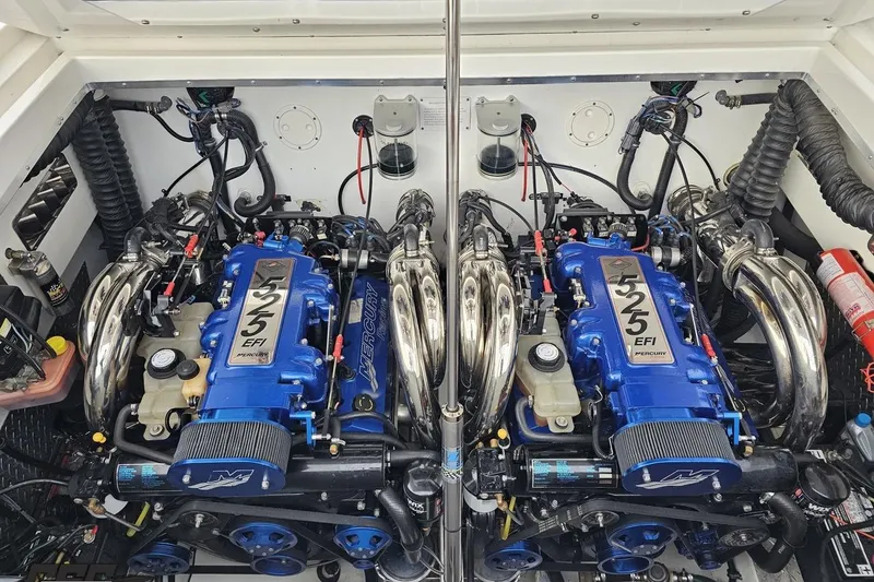 Slide: The Image of Twin Mercury 525 EFI engines in a 2004 Black Thunder 460 boat engine compartment. - 122